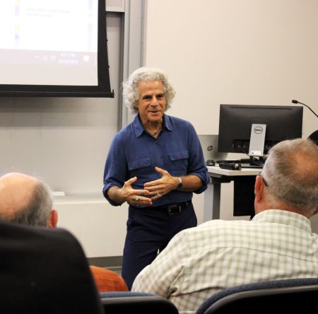 Michael Sussman explaining his methodologies to various stakeholders.